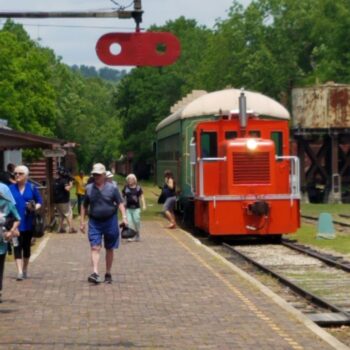 Eureka Springs & North Arkansas Railway locomotive and people walking