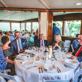 Bombadil's Cafe table with men and women sitting around having lunch